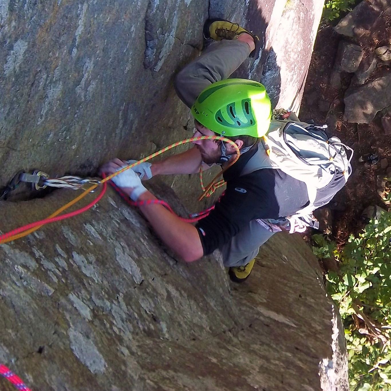 A rock climber stemming up a corner